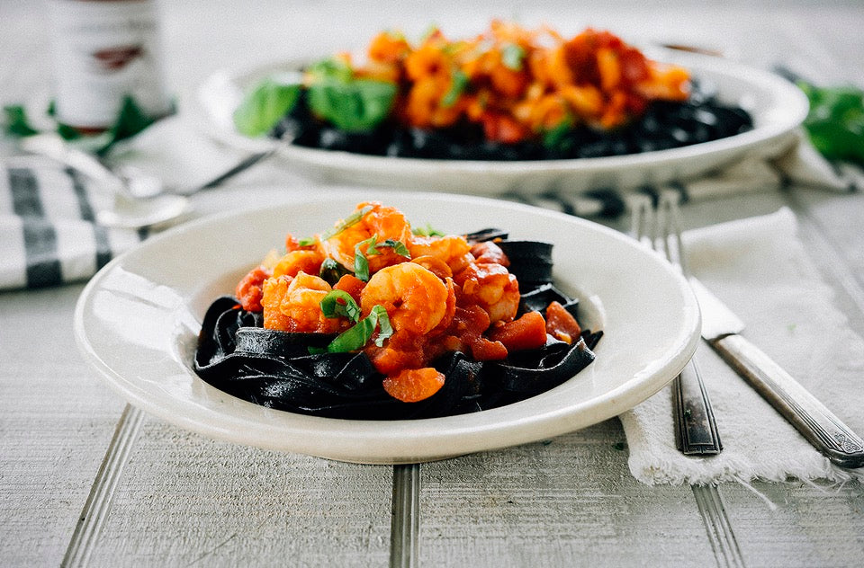 Shrimp with Spicy Harissa Tomato Sauce on Squid Ink Pasta – Casablanca Market